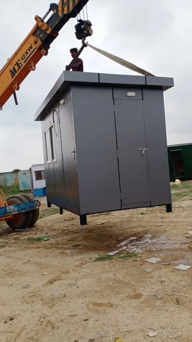 ACP Portable Security Cabin 8 × 8 ft being positioned on site, showing the entrance door, sliding window and ACP panelling