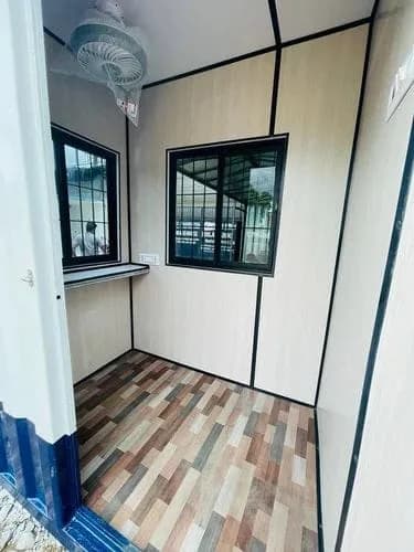 MS Portable Security Cabin interior with ceiling fan, windows and inside shelf