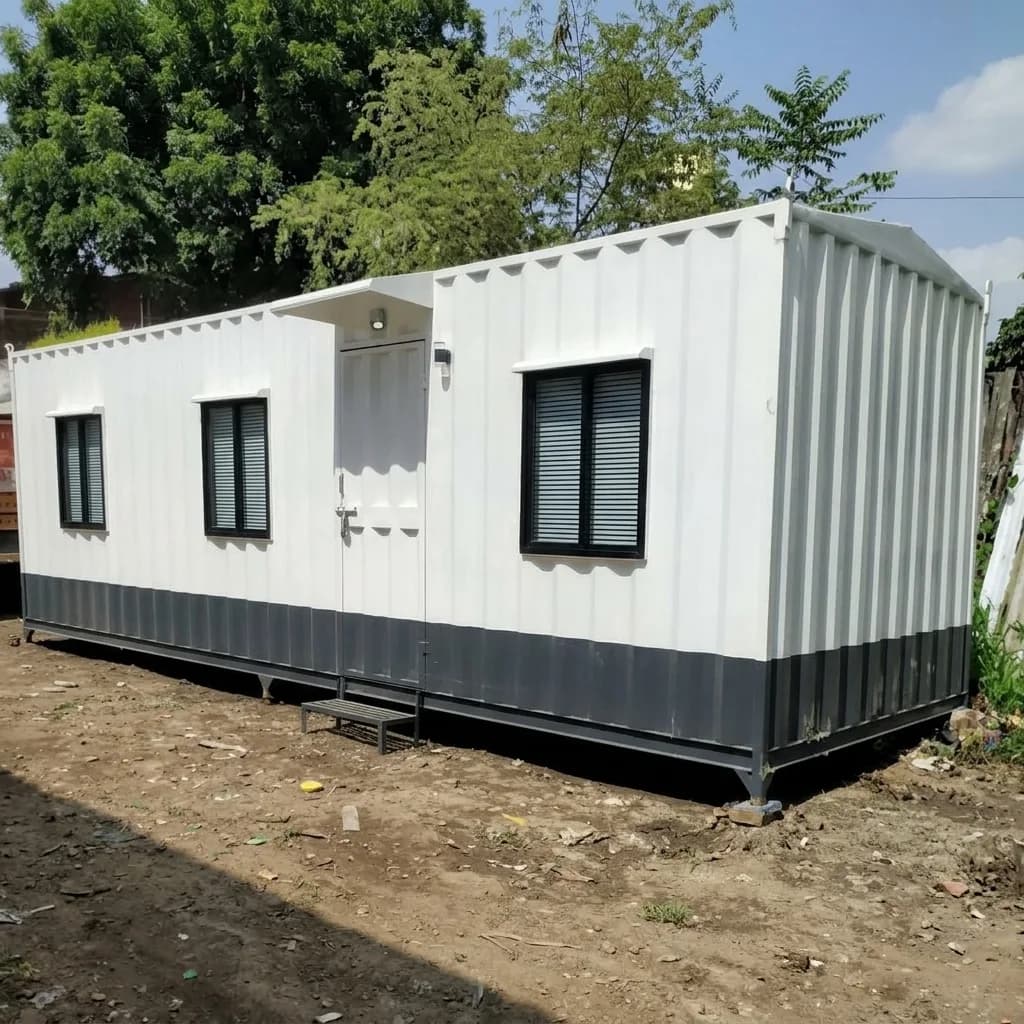 30 × 10 ft portable site office in white with a grey base, angled view showing the personnel door, step and windows, by Porta Cabin Systems