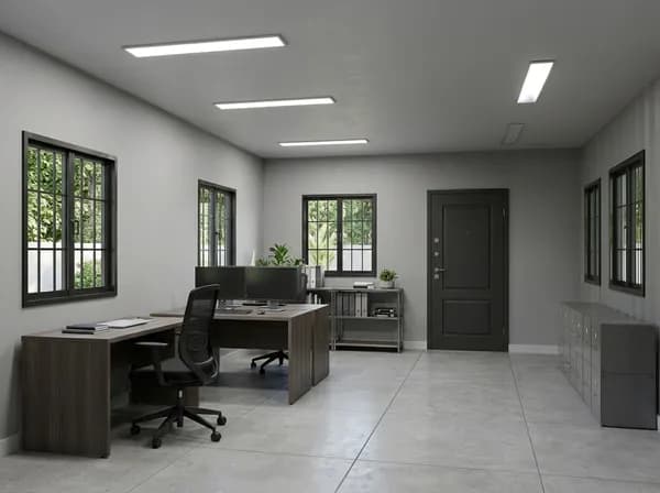 Design visualisation of a porta cabin interior set up as an office, with grey walls and barred windows, ceiling panel lights, wooden desks with a monitor and an office chair, a shelf unit and grey filing cabinets