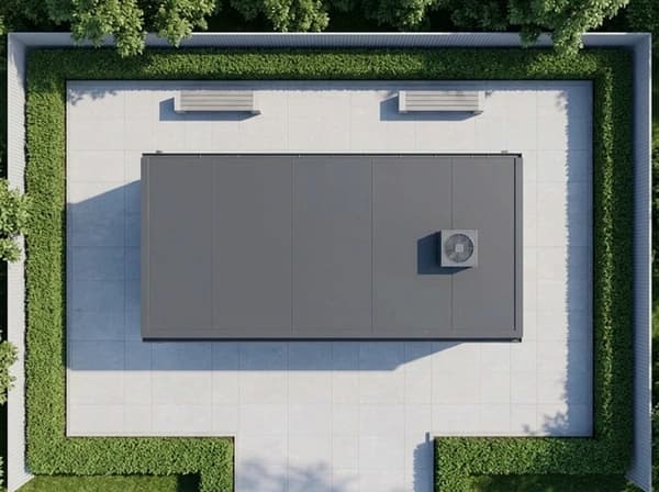 Design visualisation of a dark grey porta cabin seen from directly above, a flat roof with an air-conditioning unit near one end, on a paved yard with two benches inside a clipped hedge and a boundary wall