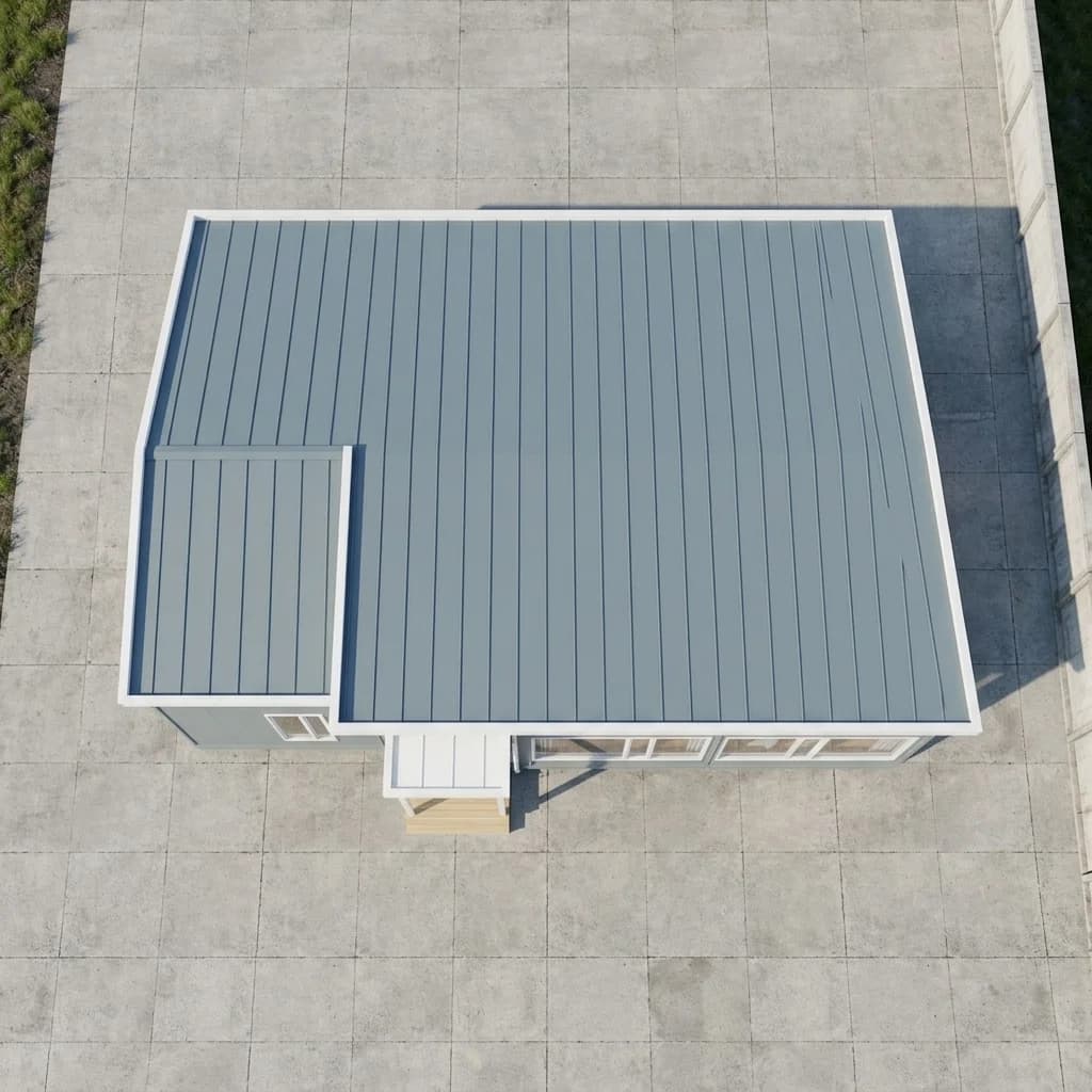 Top view of a single-storey office with a ribbed grey roof and white trim, a lower roof over one end and a small canopy over the entrance steps
